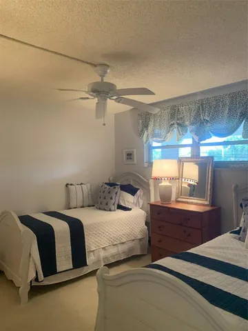 a bedroom with a bed and a table in it