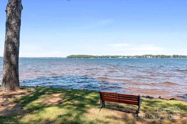 a view of a house with swimming pool and sitting area