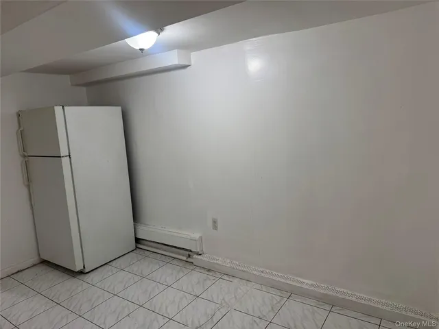a view of a refrigerator in kitchen and dishwasher