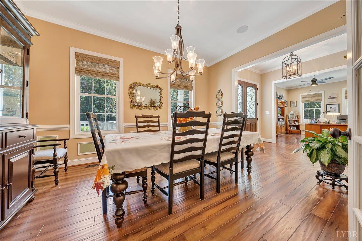 699 Police Tower Road Appomattox, VA 24522 - Photo 18 of 66 a view of a dining room with furniture window and wooden floor