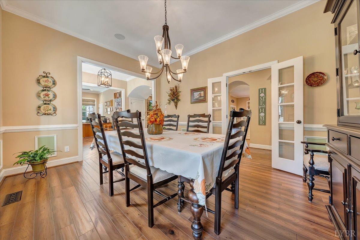 699 Police Tower Road Appomattox, VA 24522 - Photo 19 of 66 a view of a dining room with furniture window and wooden floor