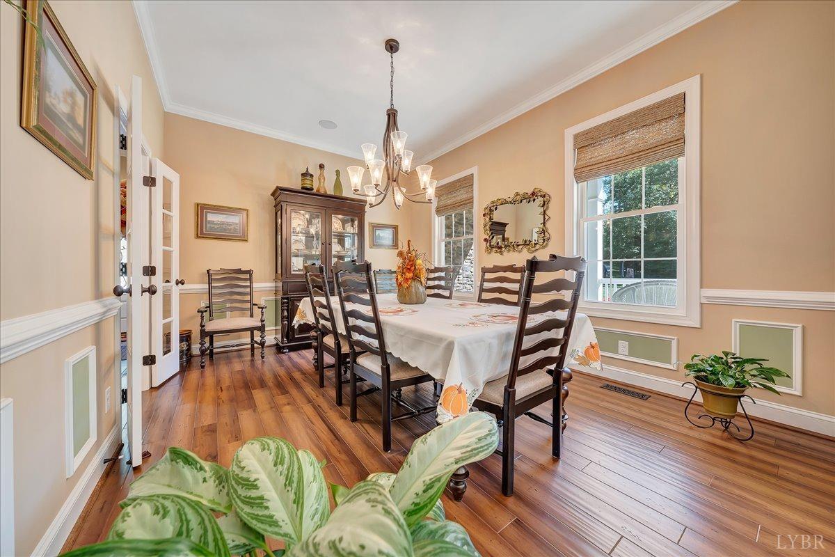 699 Police Tower Road Appomattox, VA 24522 - Photo 20 of 66 a view of a dining room with furniture window and wooden floor