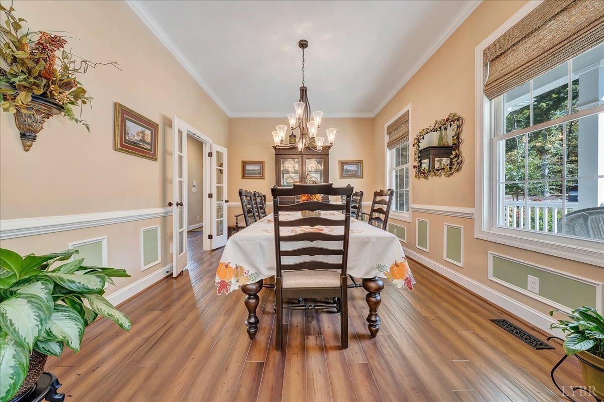 699 Police Tower Road Appomattox, VA 24522 - Photo 21 of 66 a view of a dining room with furniture window and wooden floor