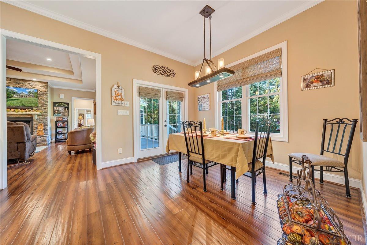 699 Police Tower Road Appomattox, VA 24522 - Photo 22 of 66 a view of a dining room with furniture window and wooden floor