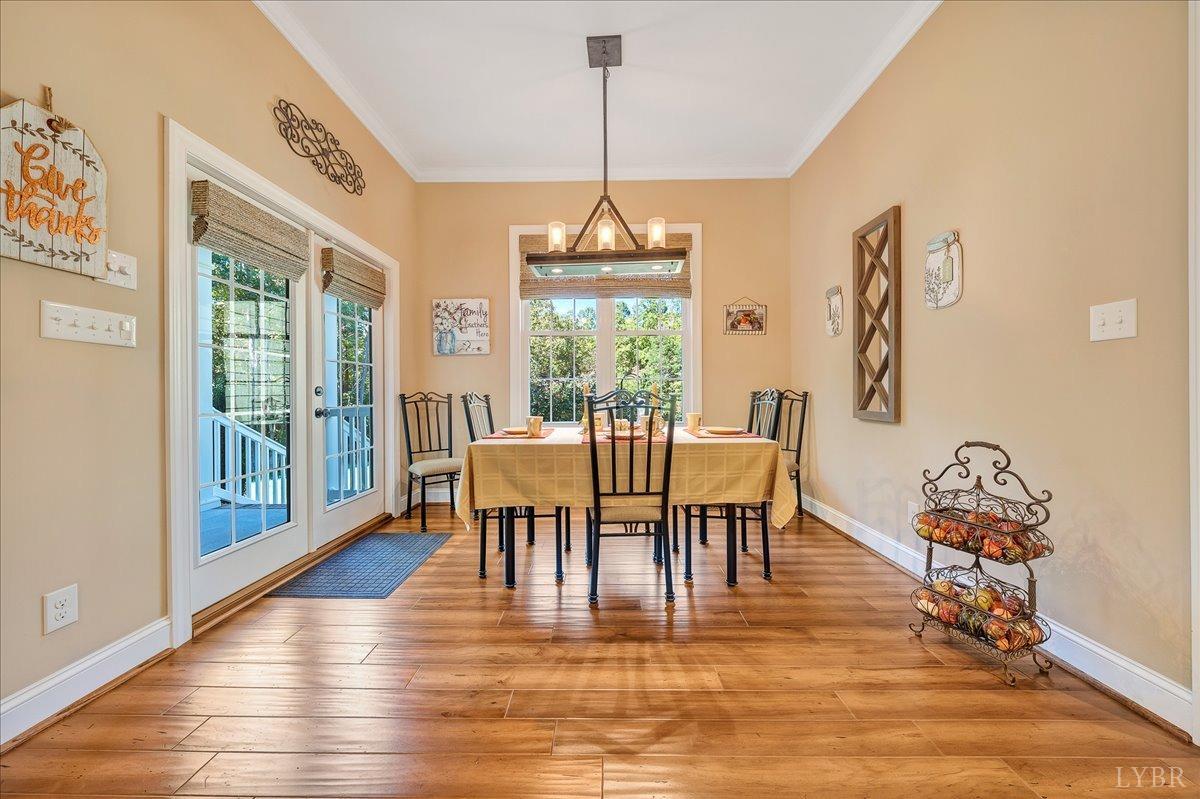 699 Police Tower Road Appomattox, VA 24522 - Photo 23 of 66 a view of a dining room with furniture window and wooden floor