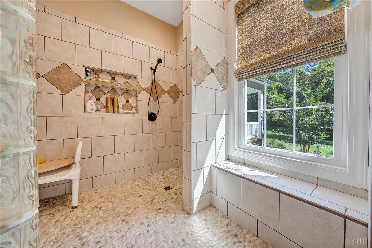 699 Police Tower Road Appomattox, VA 24522 - Photo 36 of 66 a bathroom with a bathtub and shower