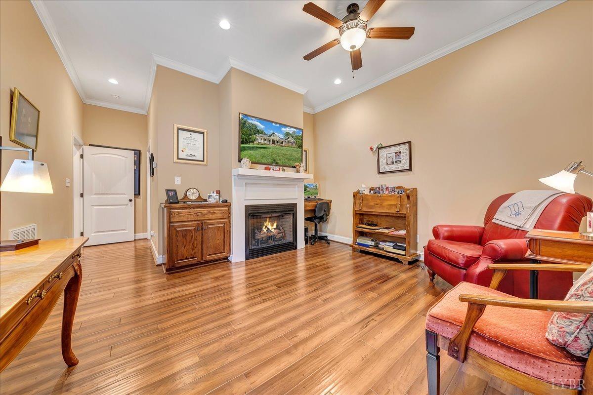 699 Police Tower Road Appomattox, VA 24522 - Photo 39 of 66 a living room with furniture and a flat screen tv