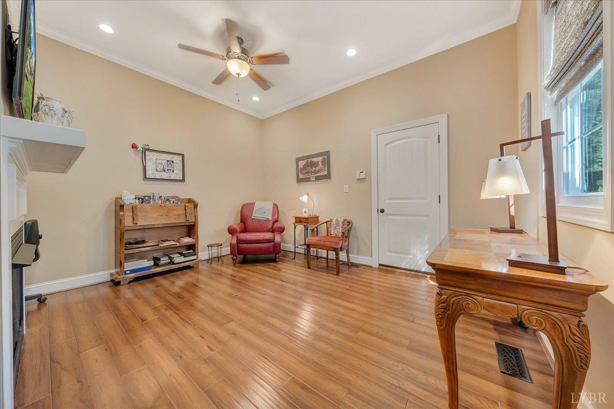 699 Police Tower Road Appomattox, VA 24522 - Photo 40 of 66 a living room with furniture and a wooden floor