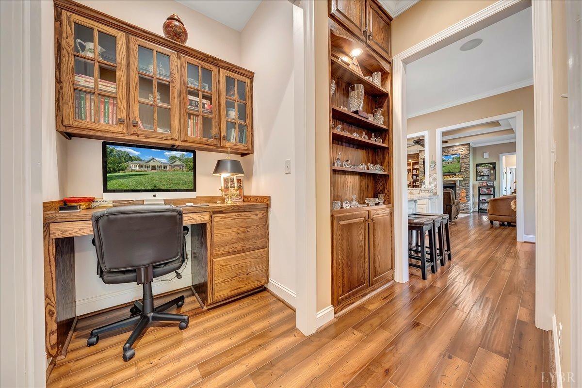 699 Police Tower Road Appomattox, VA 24522 - Photo 44 of 66 a workspace with furniture wooden floor and windows