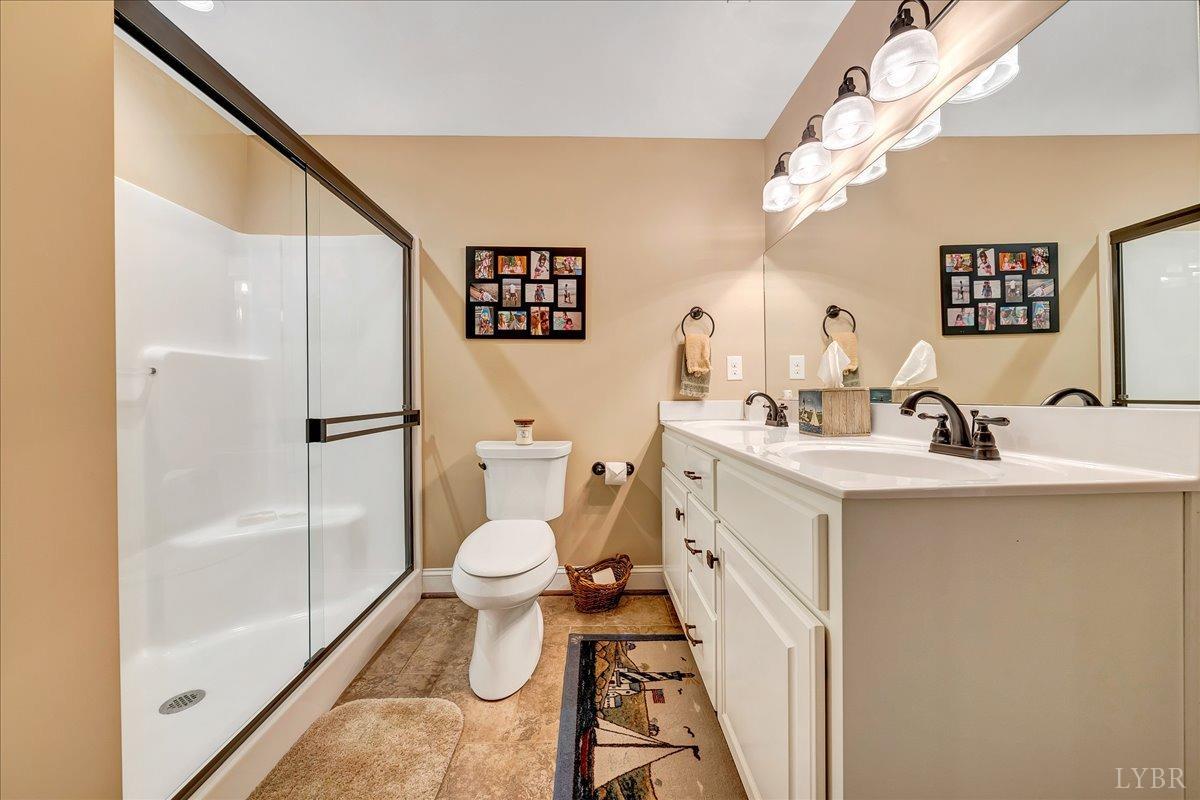 699 Police Tower Road Appomattox, VA 24522 - Photo 47 of 66 a bathroom with a sink toilet and shower