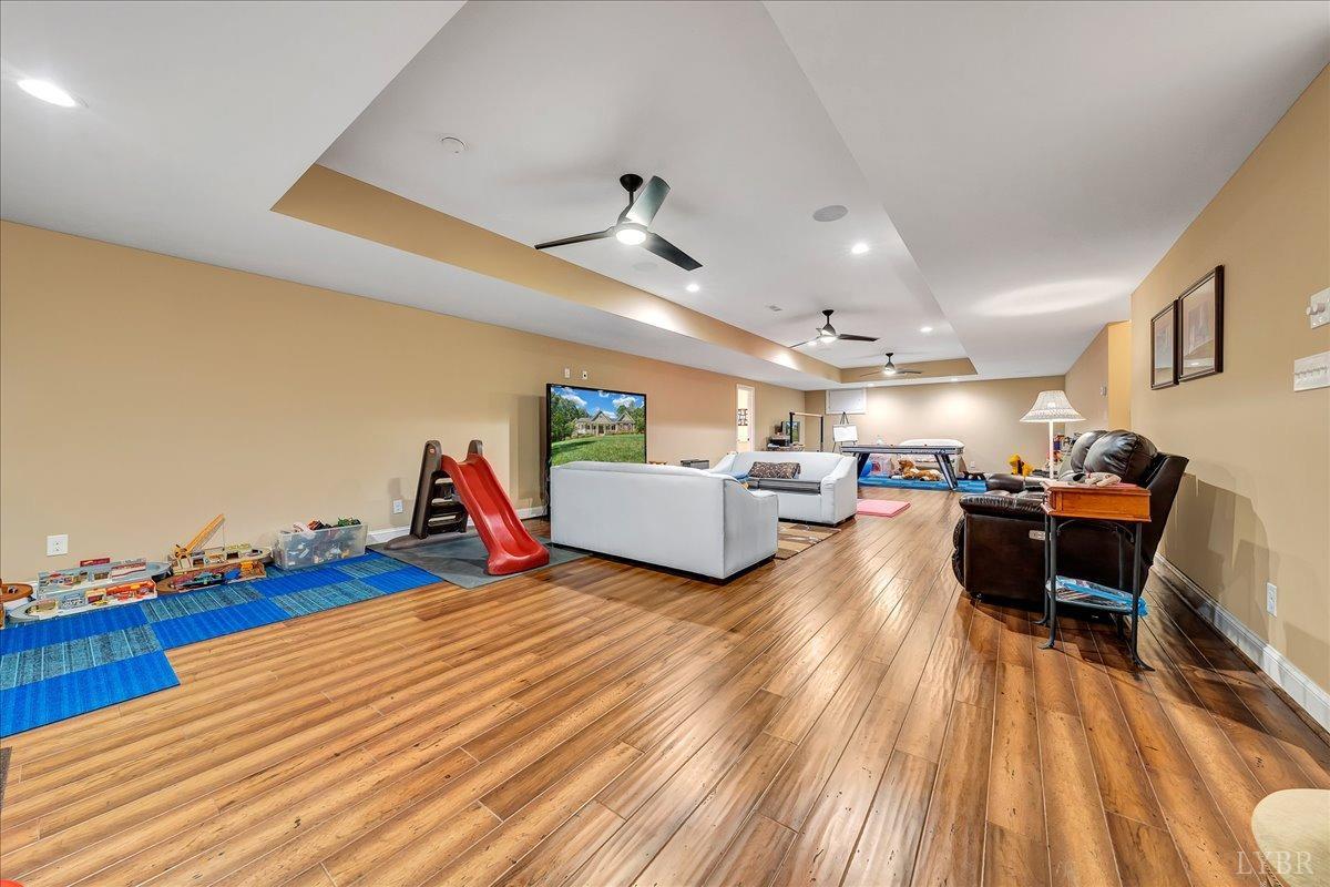 699 Police Tower Road Appomattox, VA 24522 - Photo 49 of 66 a living room with furniture and a wooden floor