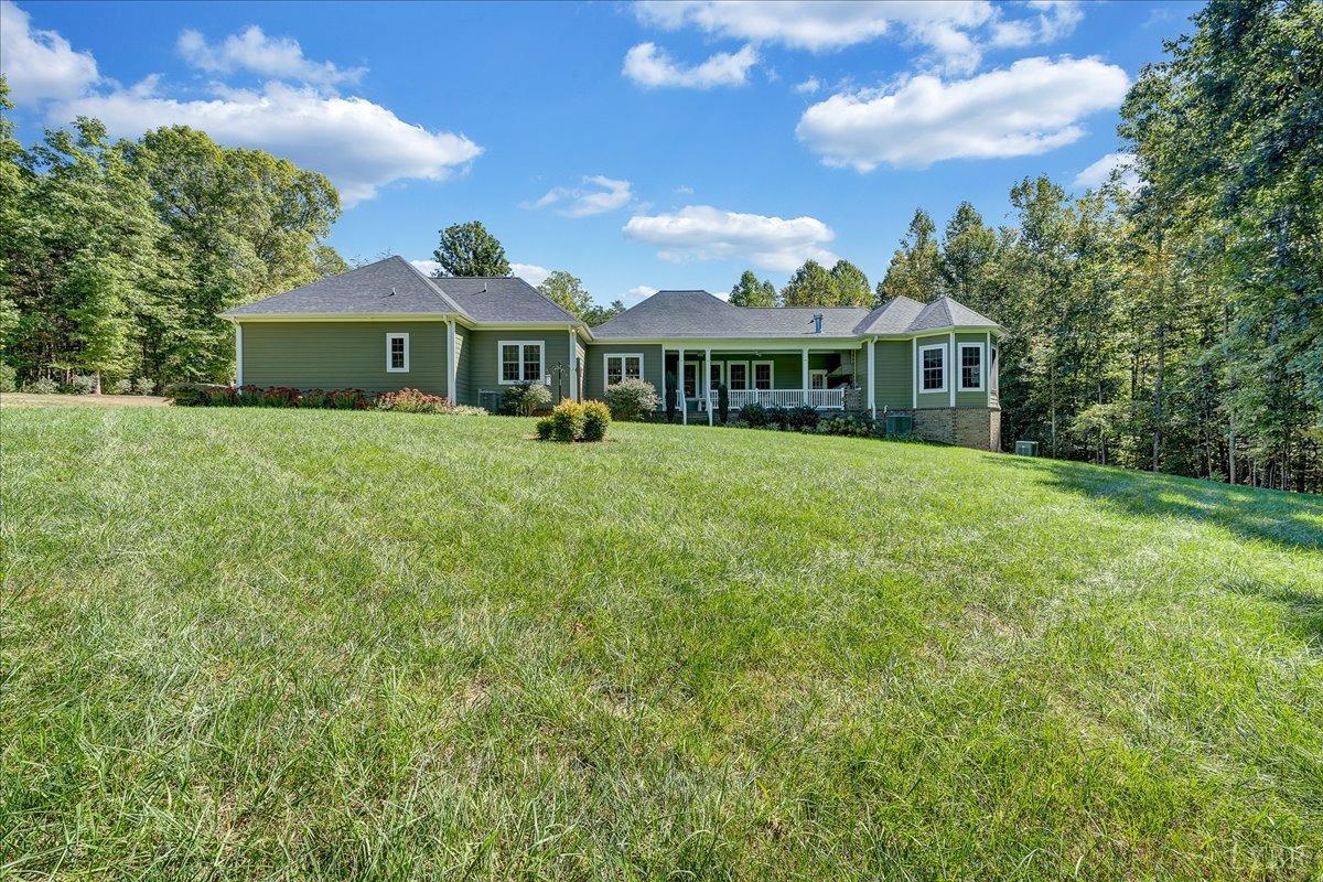 699 Police Tower Road Appomattox, VA 24522 - Photo 51 of 66 a front view of a house with a garden