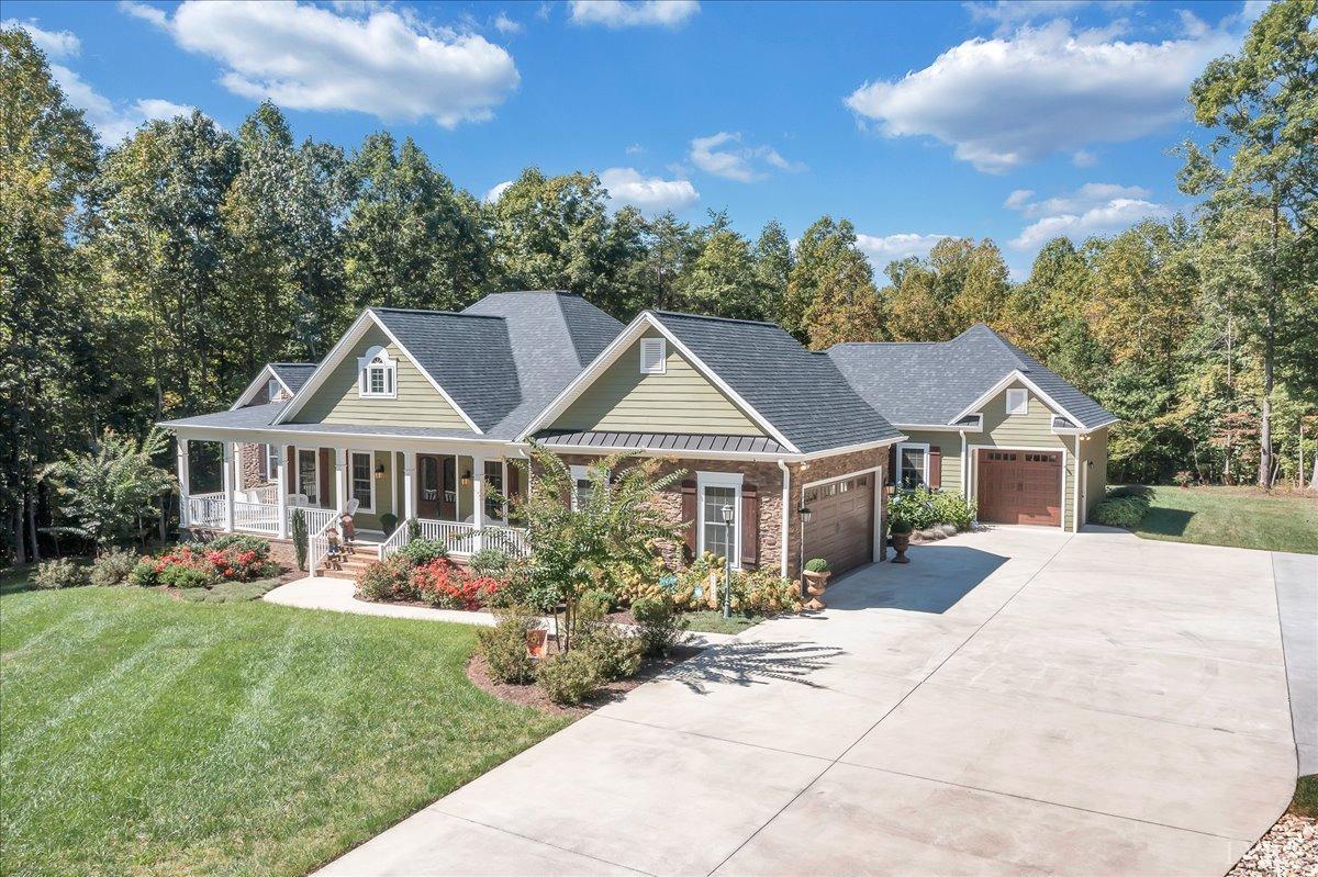699 Police Tower Road Appomattox, VA 24522 - Photo 63 of 66 a front view of a house with a garden and trees