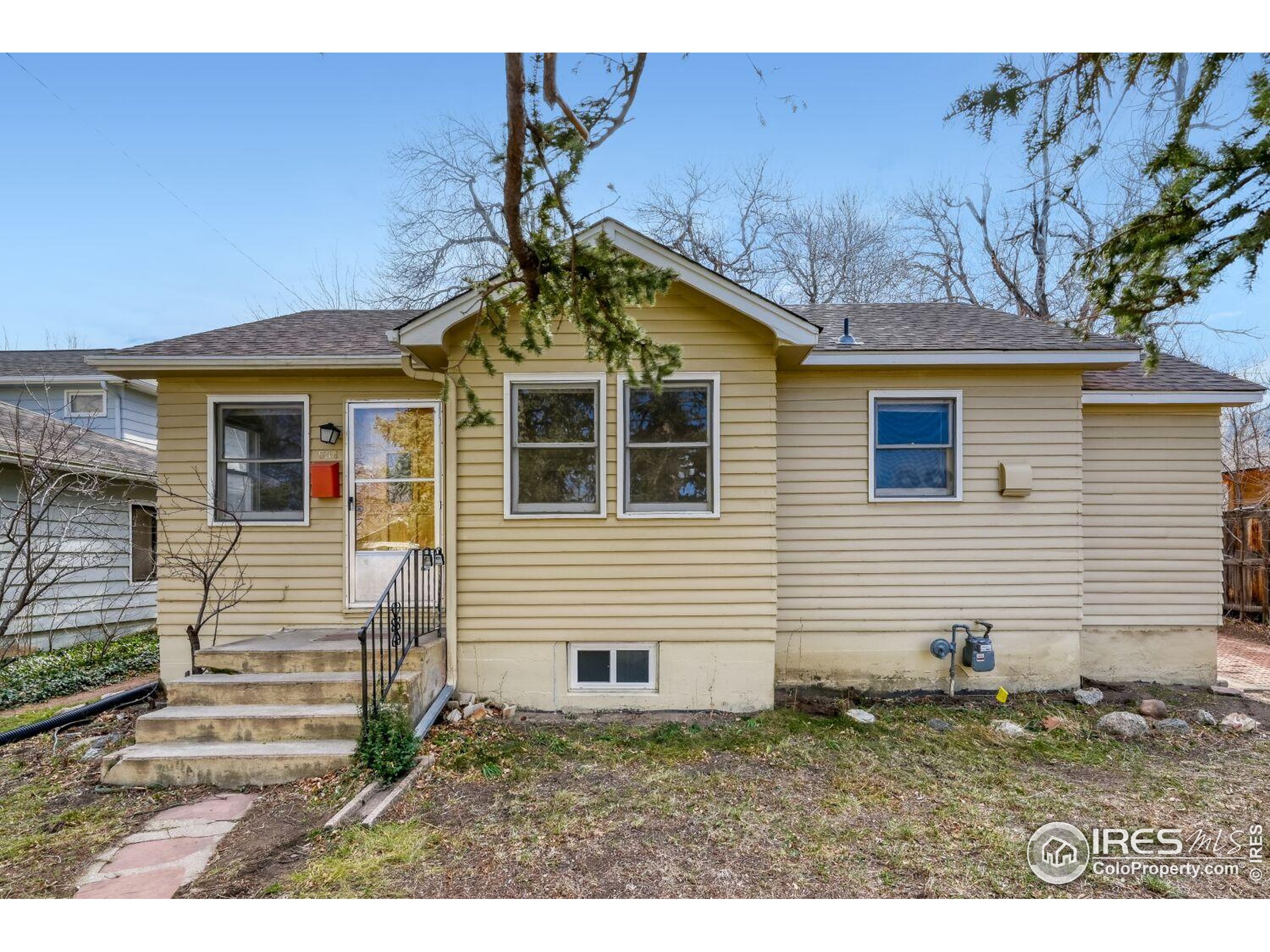 534 Dewey Avenue Boulder, CO 80304 - Photo 1 of 17 a front view of a house with a yard