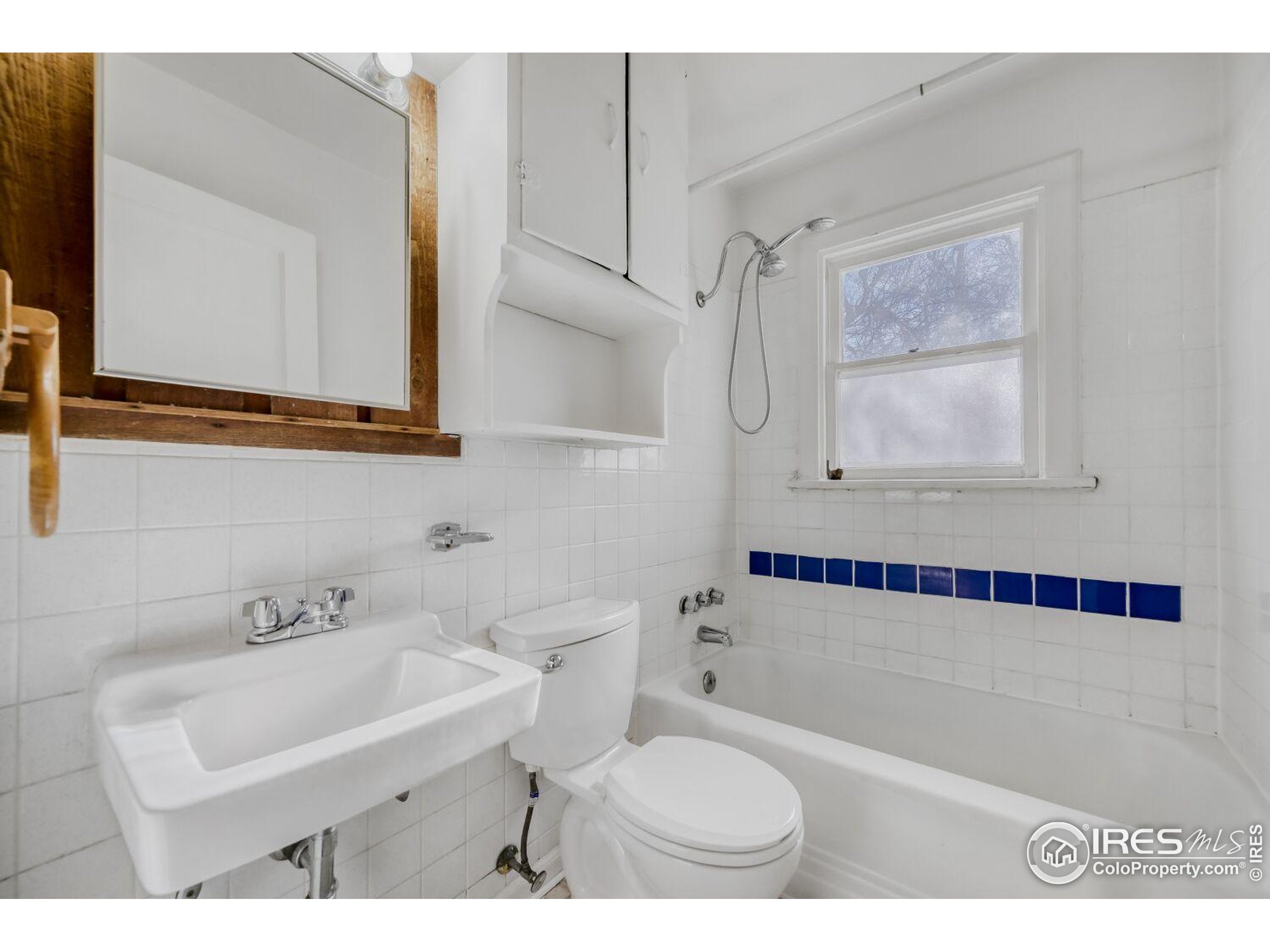 534 Dewey Avenue Boulder, CO 80304 - Photo 15 of 17 a bathroom with a sink toilet a mirror and bathtub