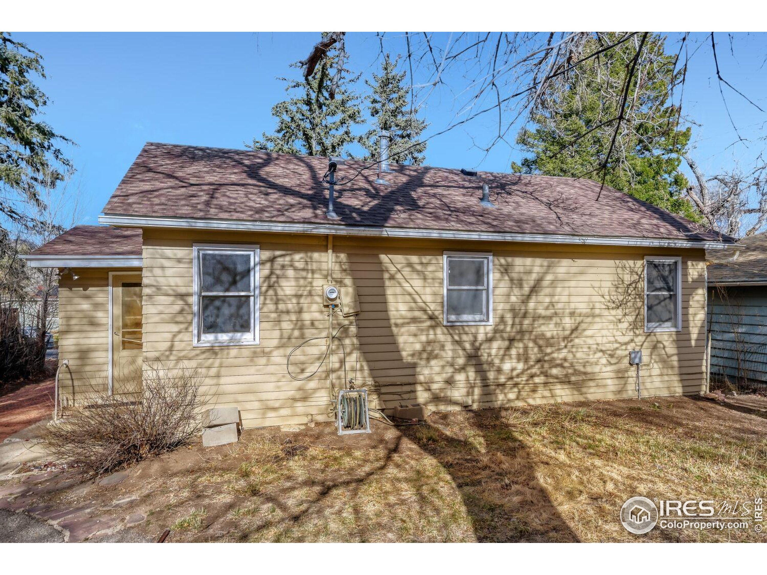 534 Dewey Avenue Boulder, CO 80304 - Photo 2 of 17 a view of a stone house with a yard