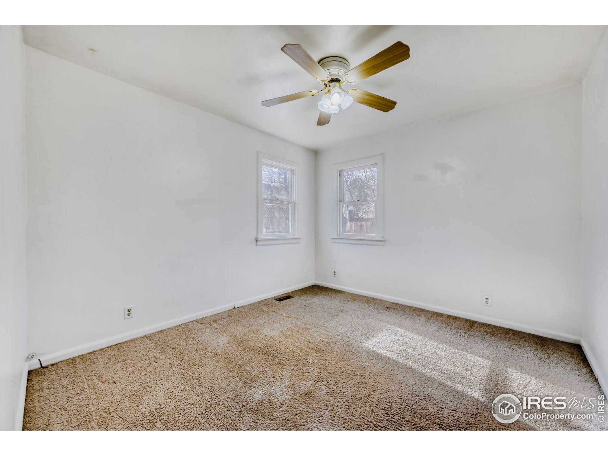 534 Dewey Avenue Boulder, CO 80304 - Photo 9 of 17 a view of an empty room with a window