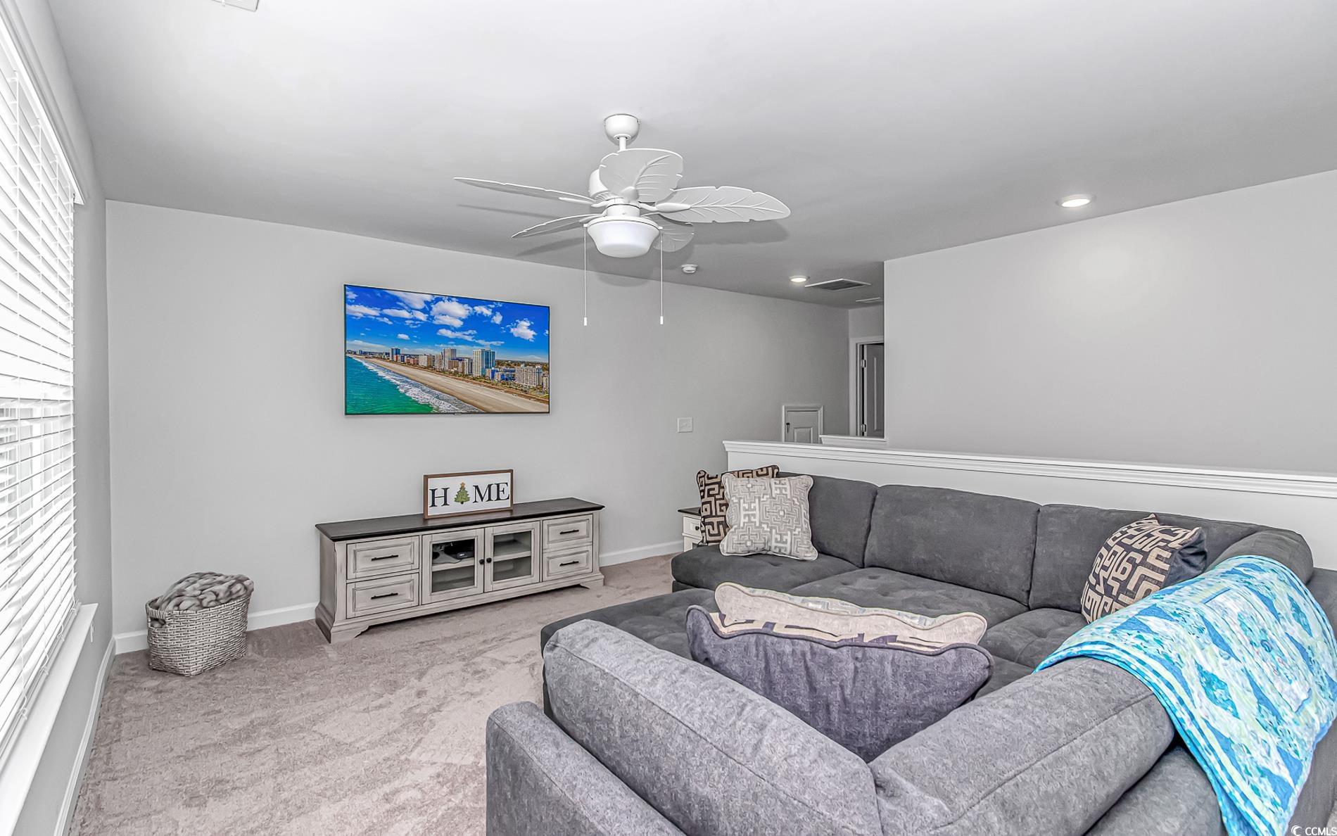 222 Sundew Loop Little River, SC 29566 - Photo 29 of 40 Carpeted living room with baseboards, recessed lig