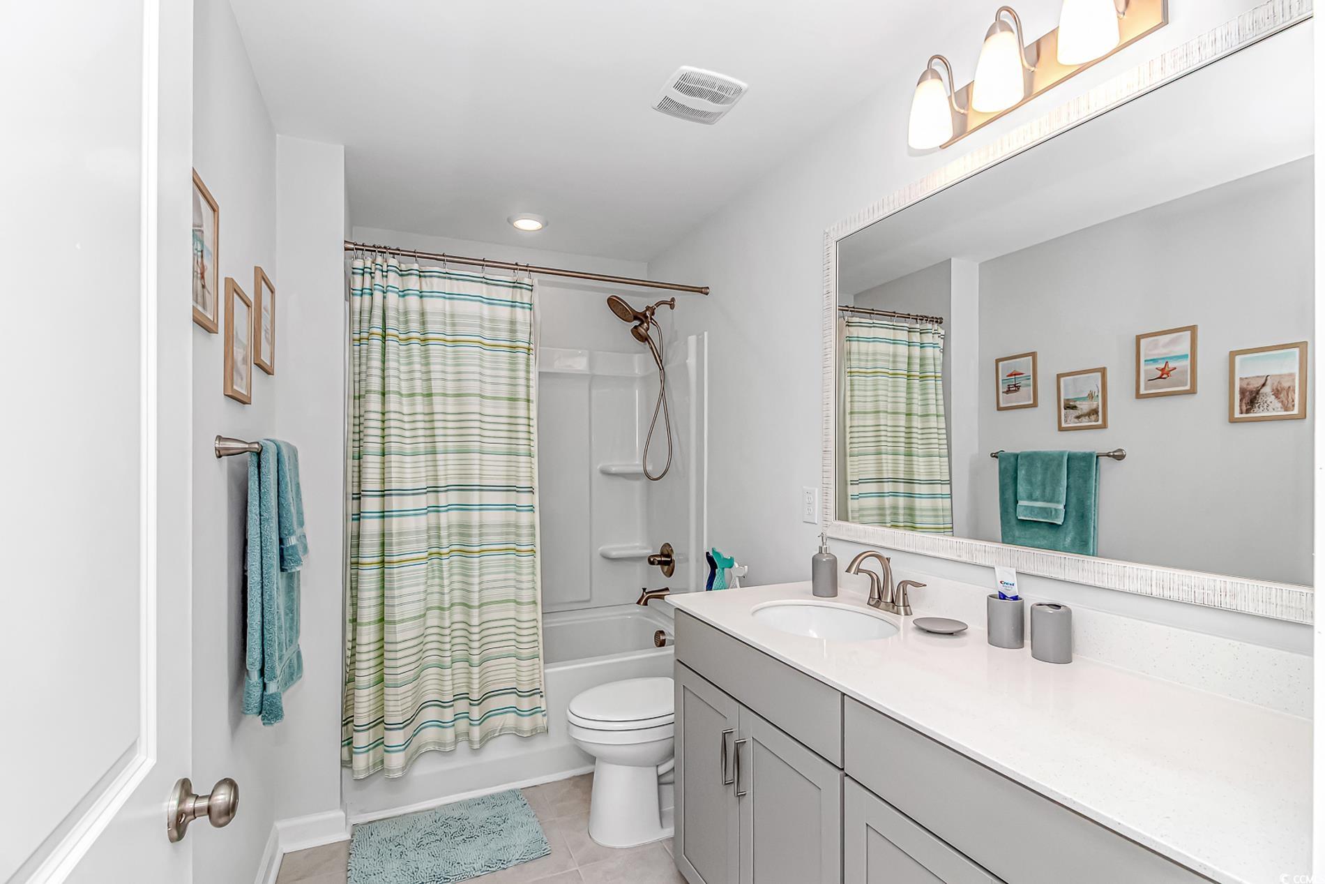 222 Sundew Loop Little River, SC 29566 - Photo 30 of 40 Bathroom featuring tile patterned floors, toilet,