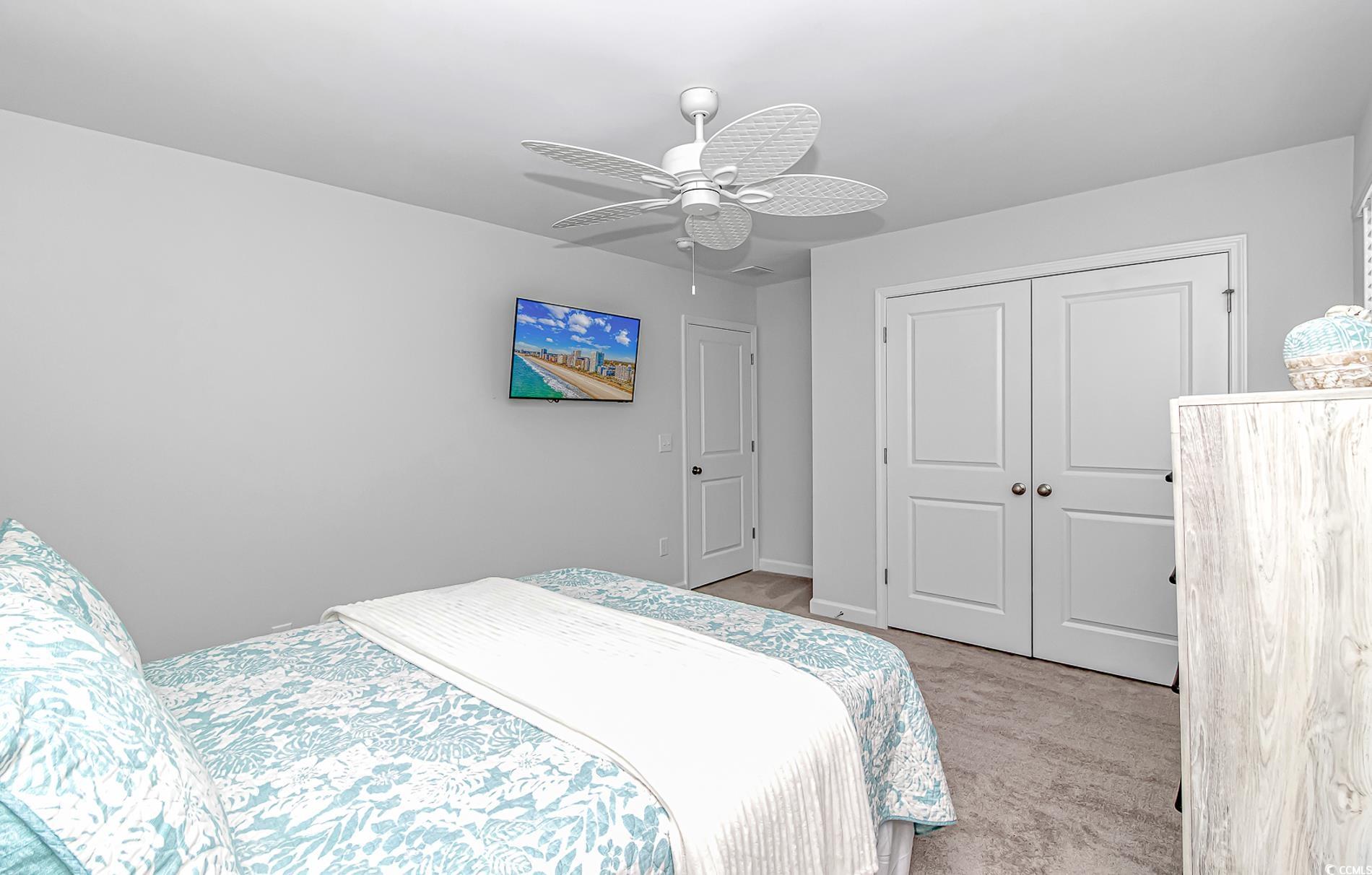 222 Sundew Loop Little River, SC 29566 - Photo 32 of 40 Bedroom with light carpet, baseboards, a closet, a