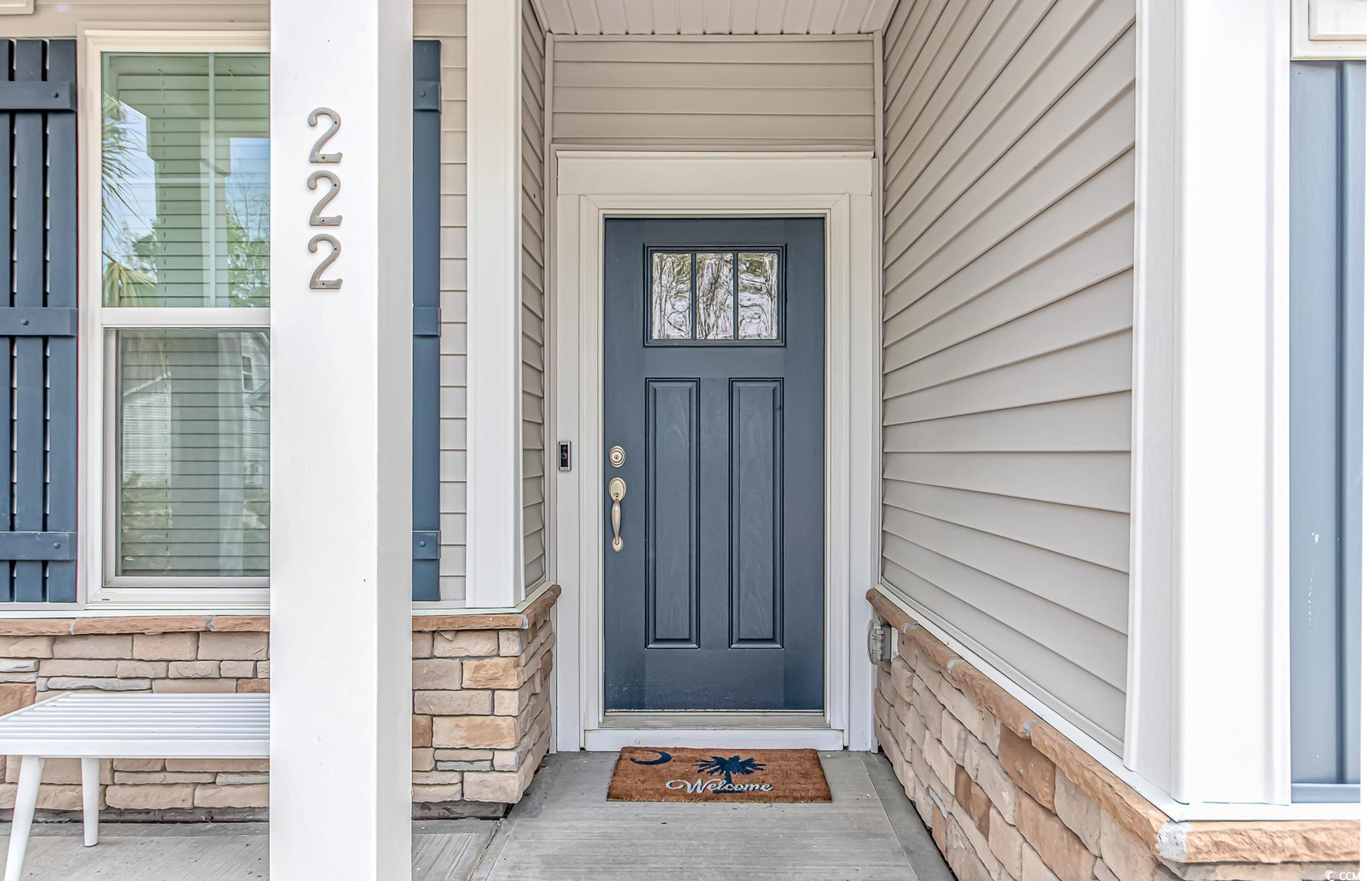 222 Sundew Loop Little River, SC 29566 - Photo 4 of 40 Property entrance with stone siding