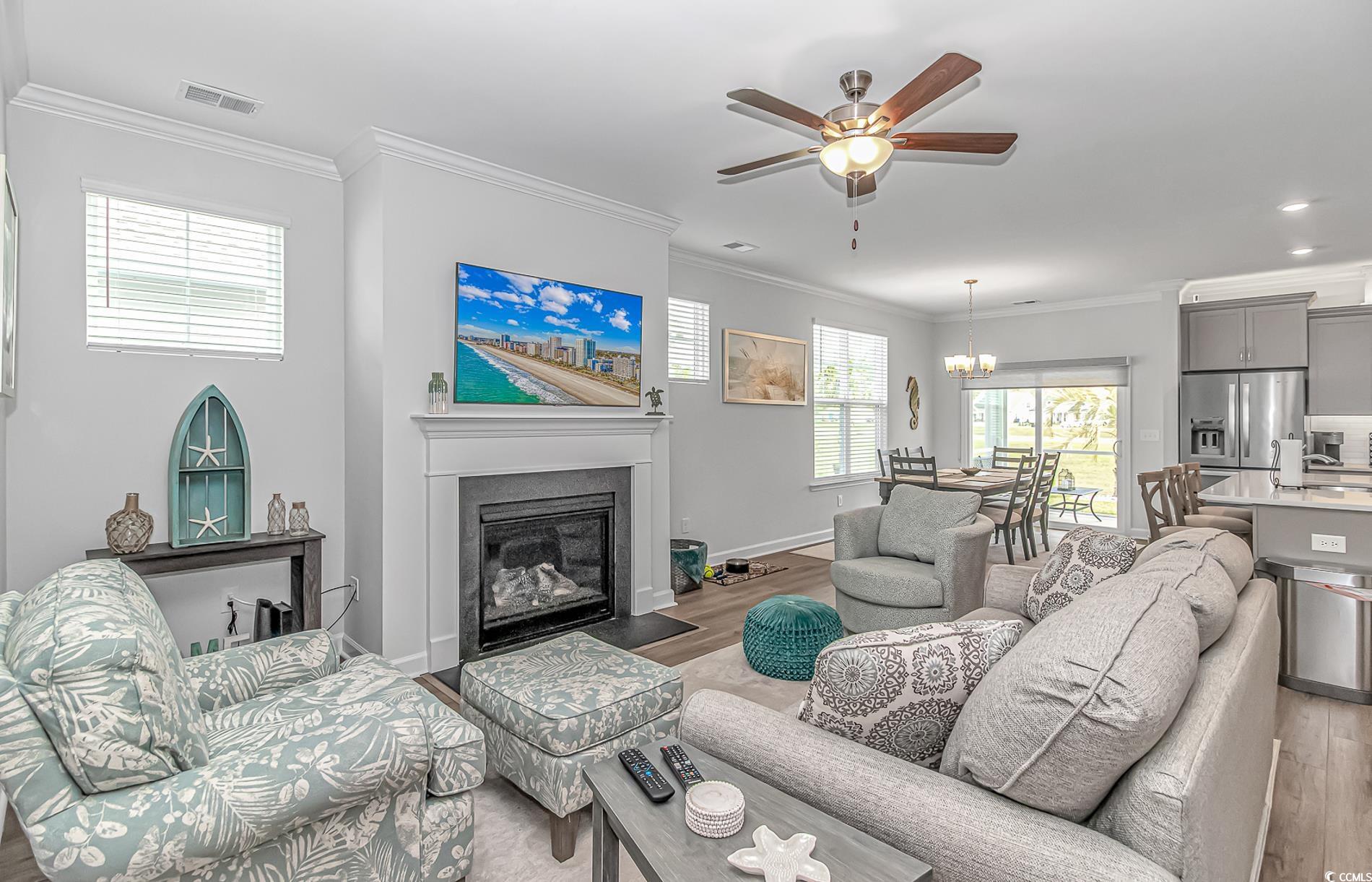 222 Sundew Loop Little River, SC 29566 - Photo 7 of 40 Living area with light wood-style flooring, visibl
