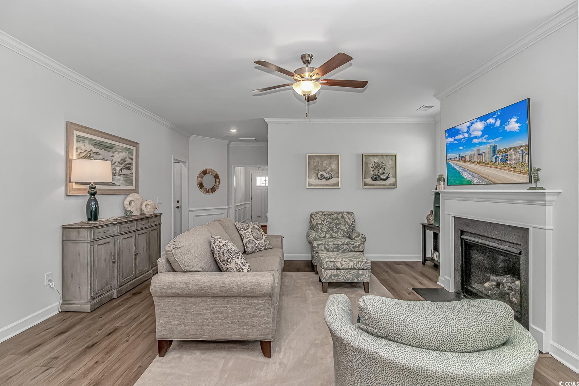222 Sundew Loop Little River, SC 29566 - Photo 8 of 40 Living area featuring a fireplace with flush heart