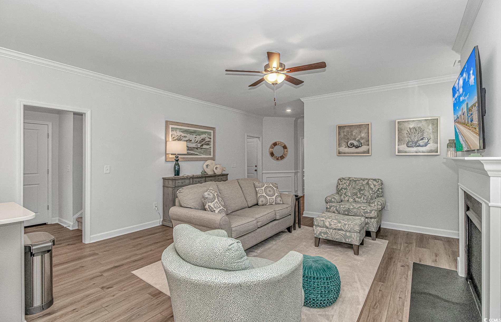 222 Sundew Loop Little River, SC 29566 - Photo 9 of 40 Living room featuring a fireplace with flush heart