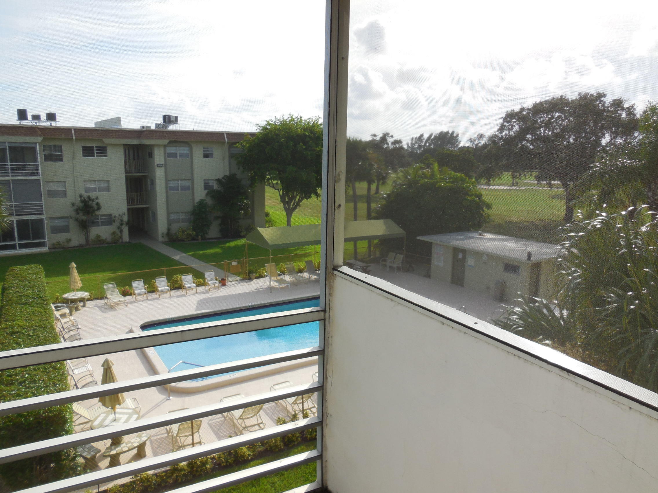 5701 Northwest 2nd Avenue, Unit 3080 Boca Raton, FL 33487 - Photo 2 of 5 a view of swimming pool from a balcony