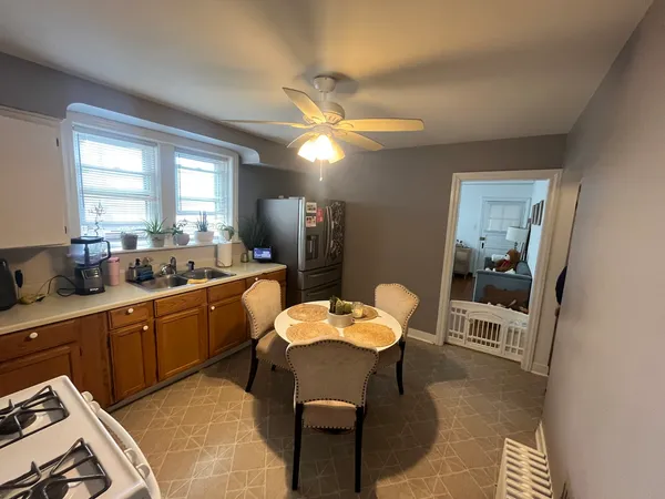 a view of a dining room with furniture and window