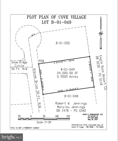 a view of a wooden bench under a tree