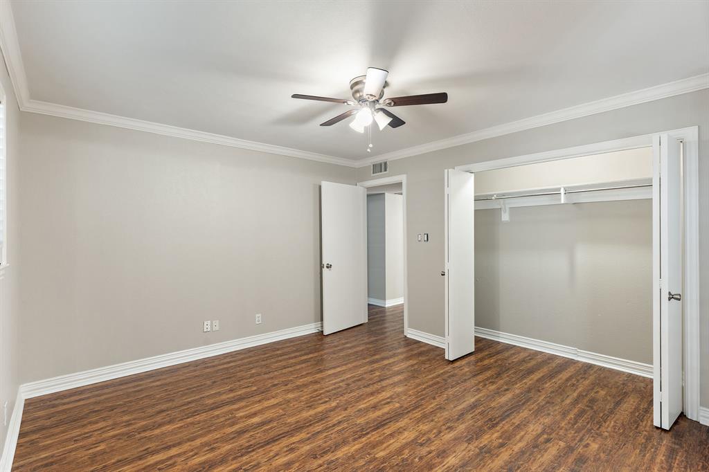 15923 Preston Road, Unit 1003 Dallas, TX 75248 - Photo 26 of 36 a view of an empty room with wooden floor