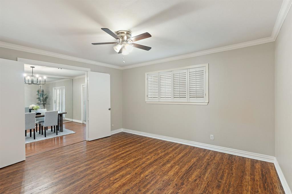 15923 Preston Road, Unit 1003 Dallas, TX 75248 - Photo 27 of 36 a view of empty room with wooden floor and fan