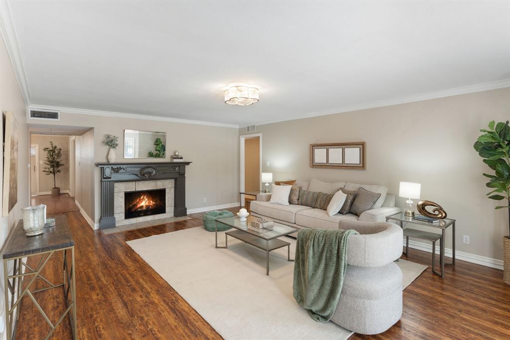 15923 Preston Road, Unit 1003 Dallas, TX 75248 - Photo 5 of 36 a living room with furniture and a fireplace