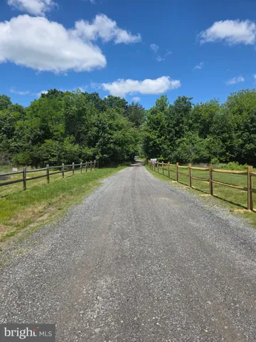 a view of a field with a big yard