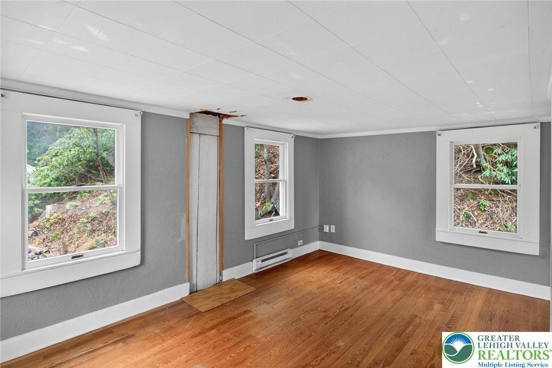 2205 Long Run Road Lehighton, PA 18235 - Photo 13 of 32 a view of an empty room with wooden floor and a window
