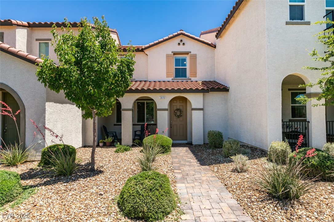 2870 Turnstone Ridge Street Henderson, NV 89044 - Photo 50 of 50 Mediterranean / spanish house featuring a tile roof, covered porch, and stucco siding