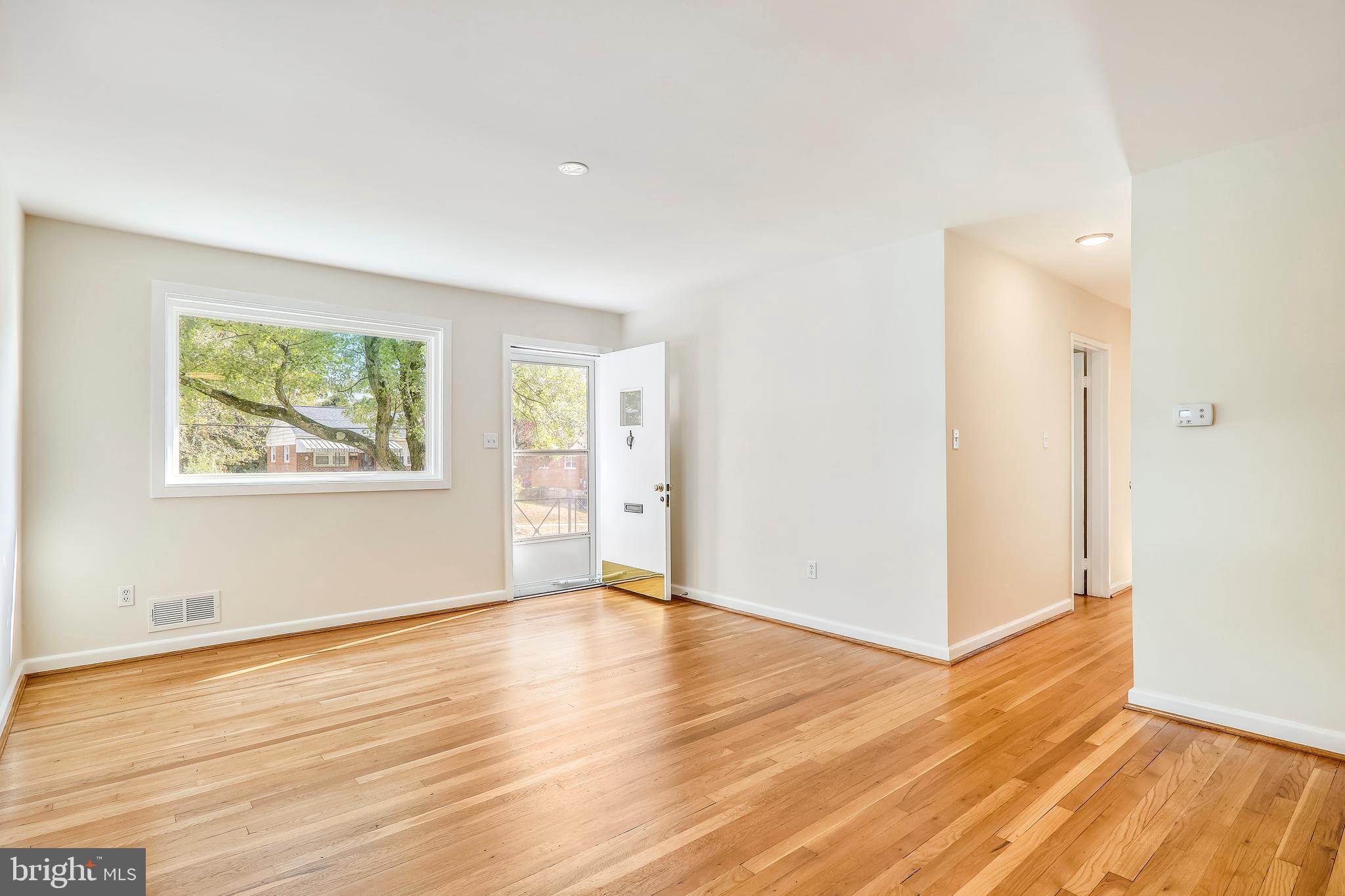 911 Whitehall Street Silver Spring, MD 20901 - Photo 6 of 68 View of LR, front door and hall to BR's