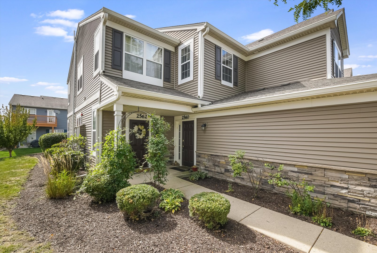 a front view of a house with garden