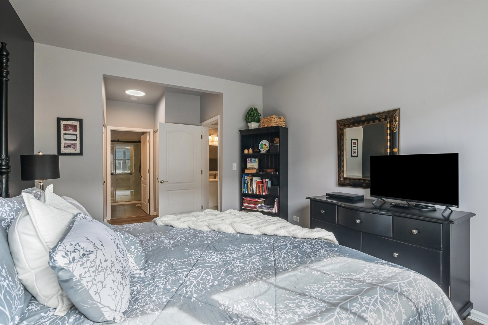 2562 Golf Ridge Circle, Unit 2562 Naperville, IL 60563 - Photo 14 of 22 a bedroom with a bed and a flat screen tv