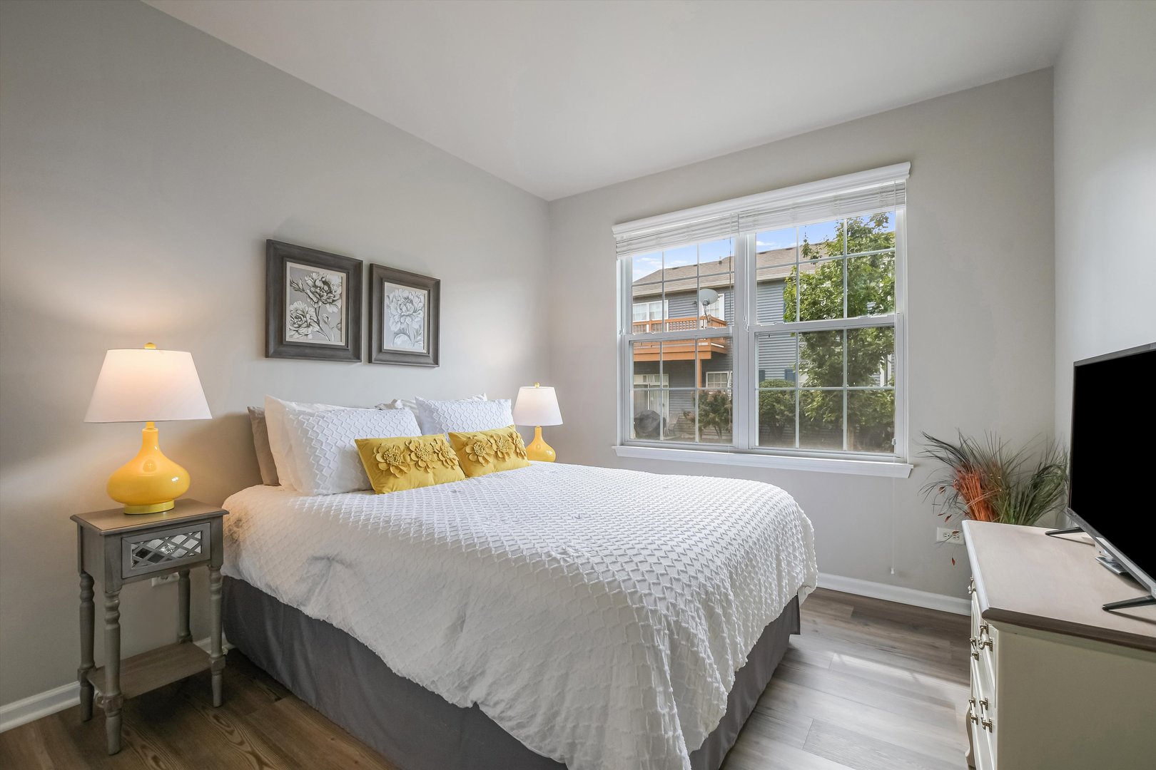 2562 Golf Ridge Circle, Unit 2562 Naperville, IL 60563 - Photo 16 of 22 a bedroom with a bed and a window