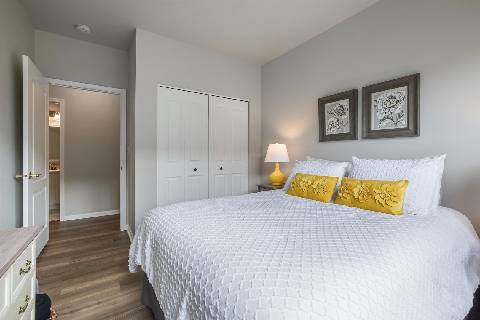 2562 Golf Ridge Circle, Unit 2562 Naperville, IL 60563 - Photo 17 of 22 a bedroom with a bed and painting on the wall