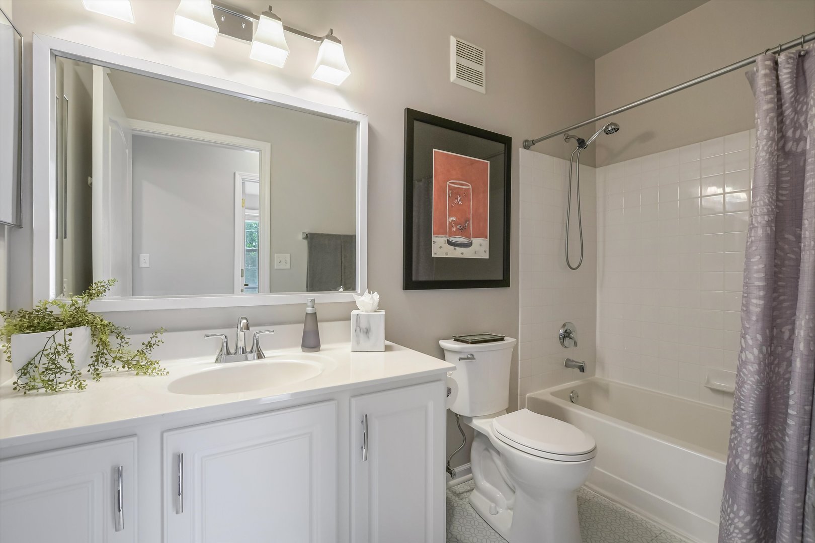 2562 Golf Ridge Circle, Unit 2562 Naperville, IL 60563 - Photo 18 of 22 a bathroom with a sink a toilet a mirror a vanity and shower