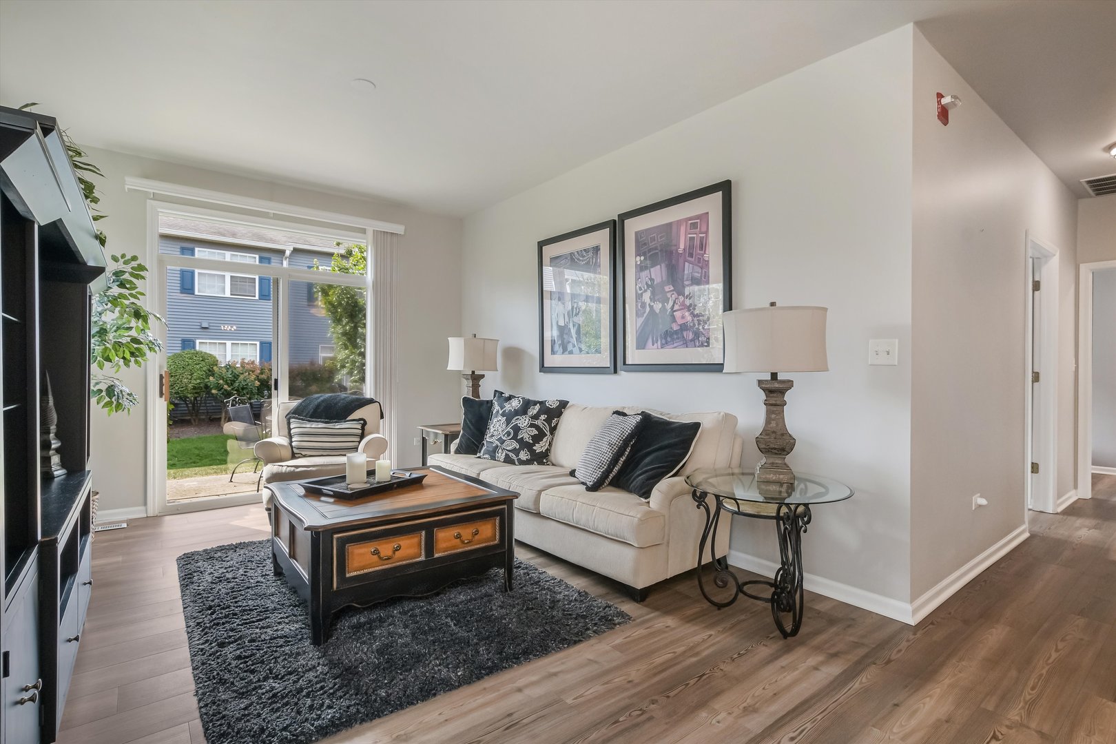 2562 Golf Ridge Circle, Unit 2562 Naperville, IL 60563 - Photo 5 of 22 a living room with furniture a rug and a large window