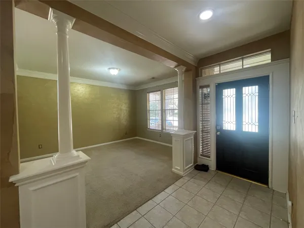 an empty room with a empty space and windows