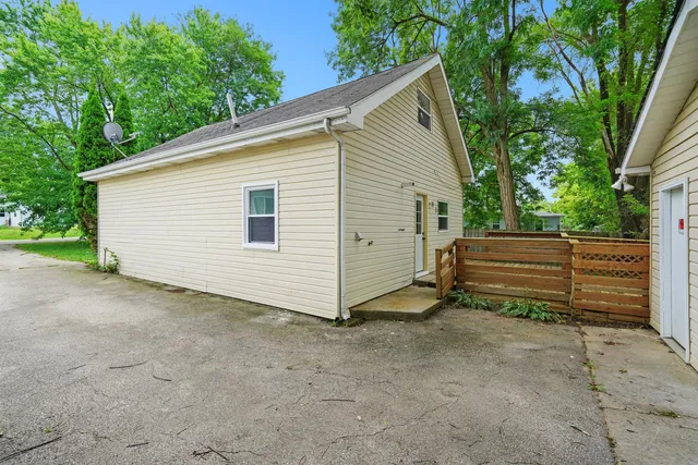 a view of a deck with wooden floor and fence