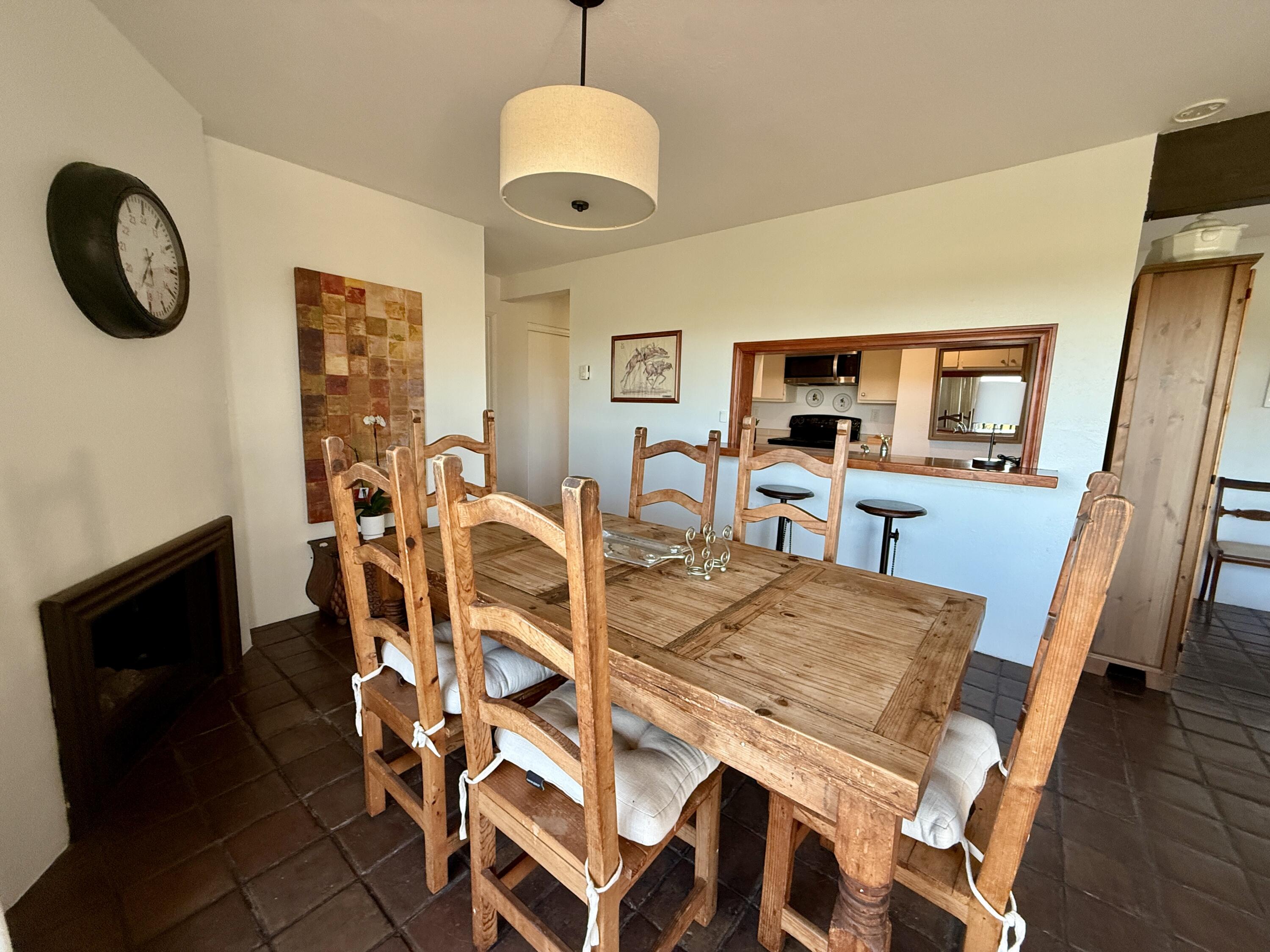 3375 Foothill Road, Unit 511 Carpinteria, CA 93013 - Photo 5 of 13 a view of a dining room with furniture and a chandelier