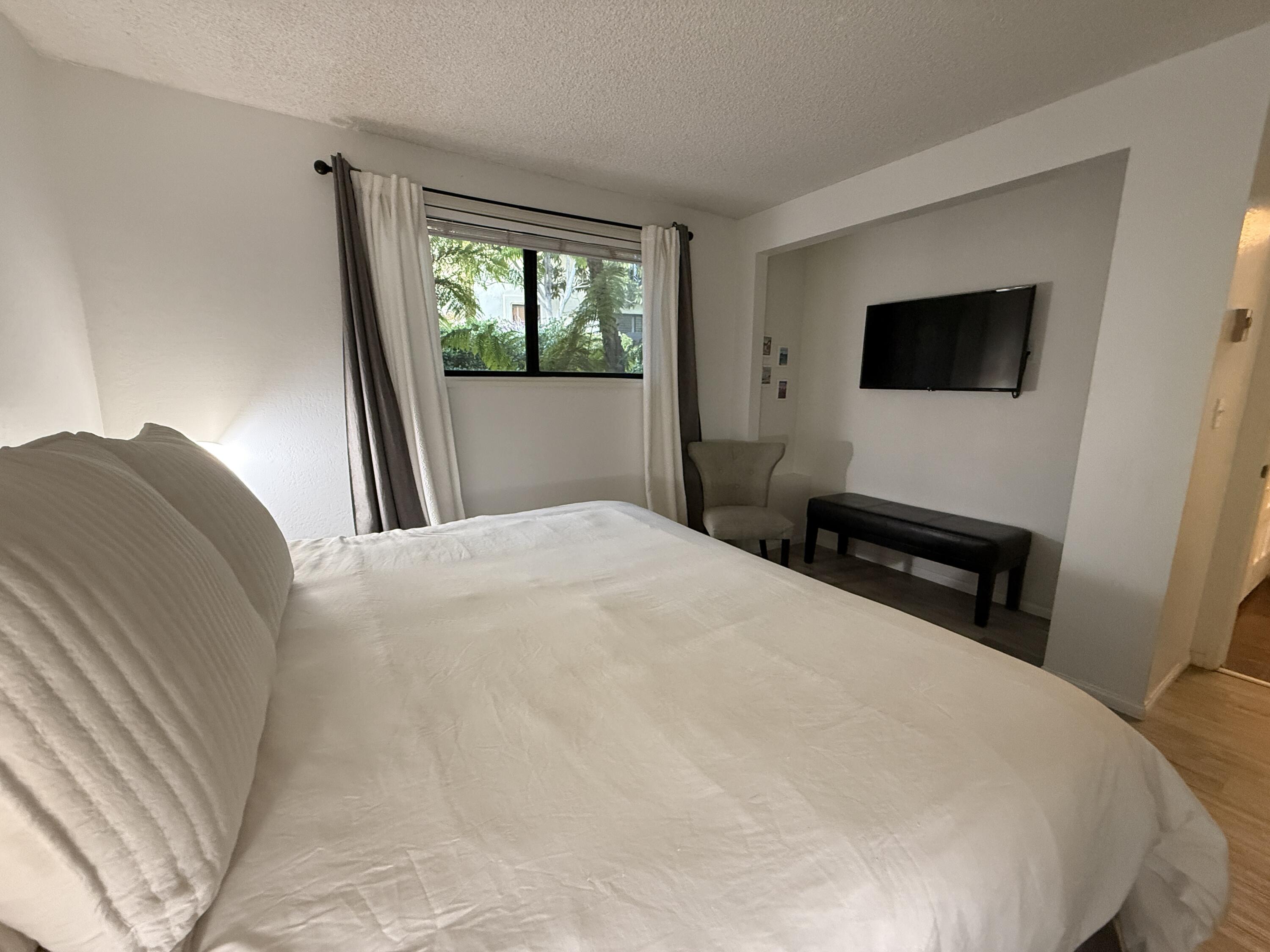3375 Foothill Road, Unit 511 Carpinteria, CA 93013 - Photo 8 of 13 a bedroom with a bed and a window