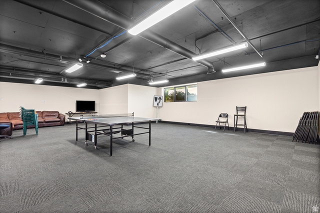 2244 North Canyon Road, Unit 212 Provo, UT 84604 - Photo 24 of 31 Expansive recreational space featuring carpet tile flooring, exposed ductwork, and fluorescent lighting