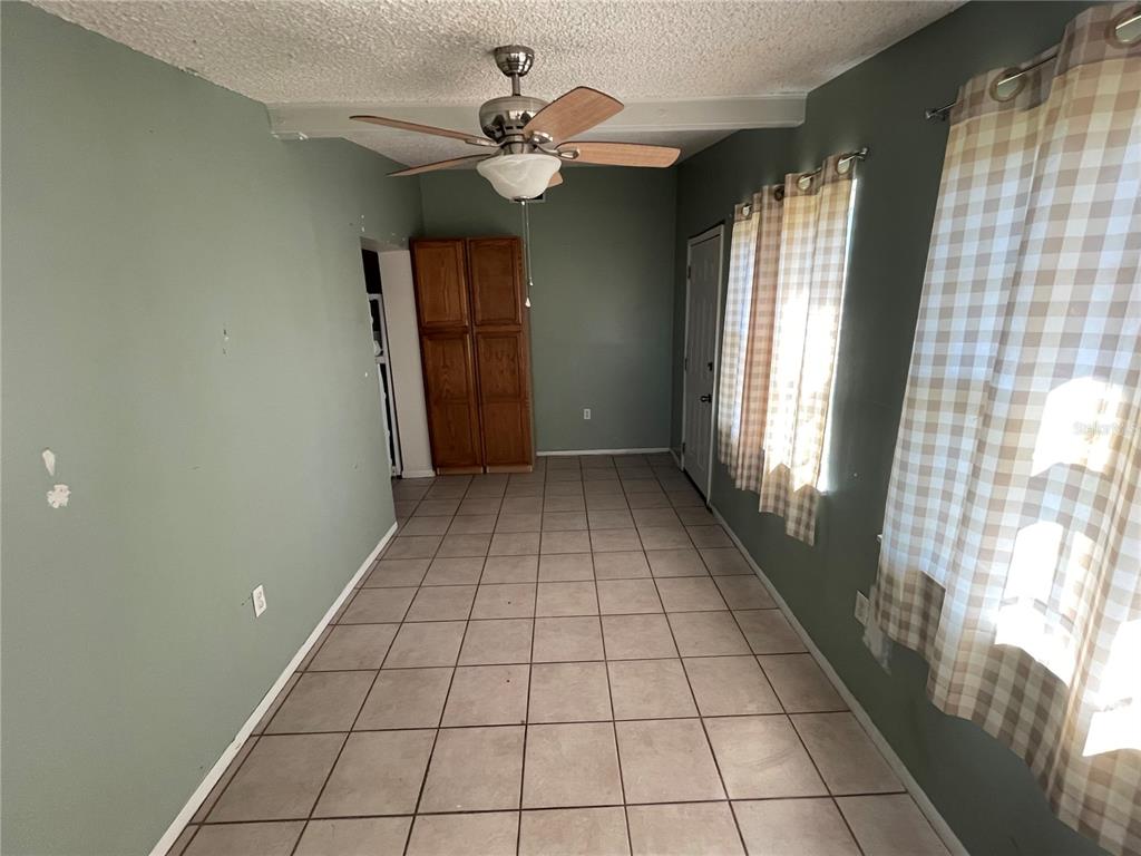 632 Cardinal Street Ocoee, FL 34761 - Photo 8 of 29 a view of an empty room with a window